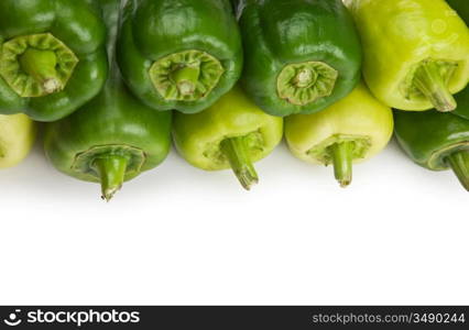 row green peppers isolated on white background
