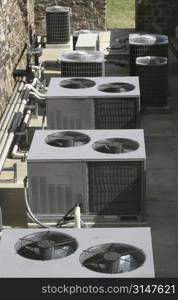 Row of AC/heating units shot from above.