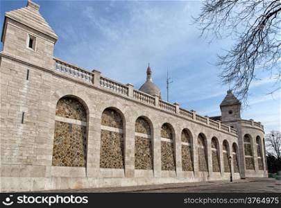 Row of arches in Roman-Byzantine style beside basilica Sacre Coeur in Paris, France