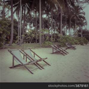 Row of beach chair on beach in vintage color style