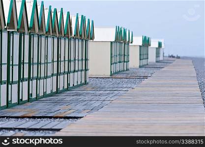 Row of beach huts before rain