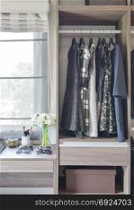 row of black and white dress in wardrobe at home