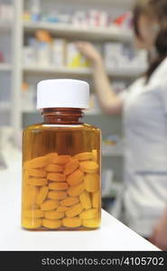 row of bottles and pills on a chemists counter