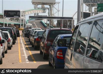 Row of cars waiting to board a ferry