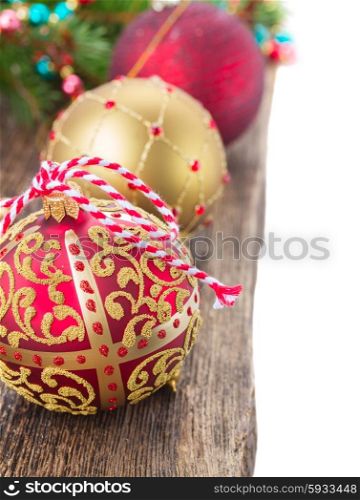 row of christmas balls decorations on wooden background border isolated on white . christmas balls on wooden background border