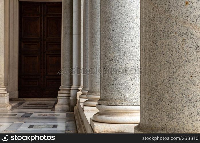 Row of column in colonnade. Classical style colonnade in Rome, Italy