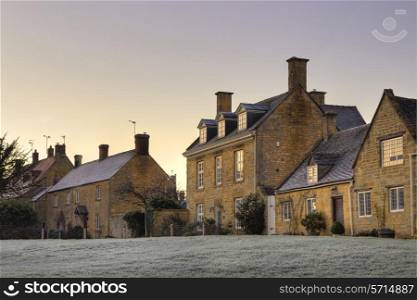 Row of Cotswold houses at sunset, Willersey near Broadway, Gloucestershire, England.
