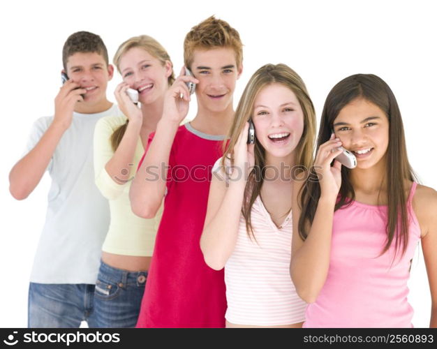 Row of five friends on cellular phones smiling