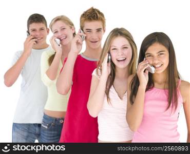 Row of five friends on cellular phones smiling