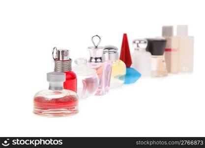 row of flasks with perfume