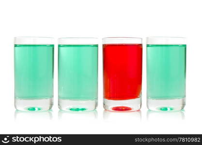 row of glasses with green and red liquid