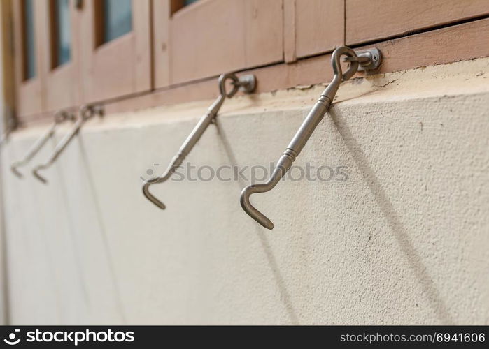 Row of hook of the windows. Focus in the front hook.