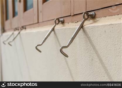 Row of hook of the windows. Focus in the front hook.