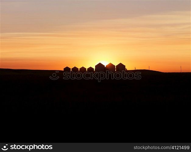 Row of Houses Silhouetted at Sunset