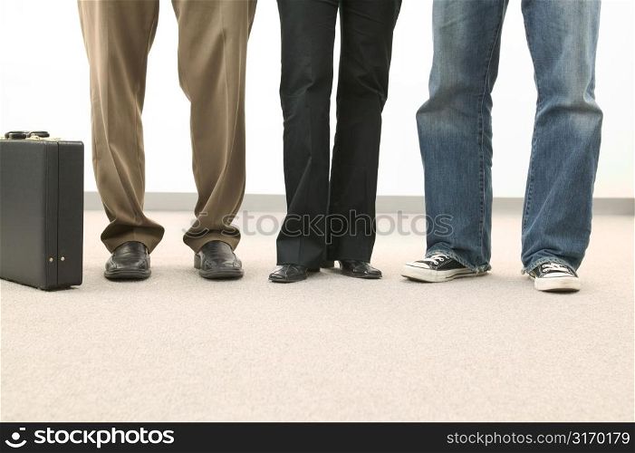 Row of Legs Wearing Different Pants