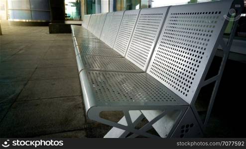 Row of metal seats at the transport station