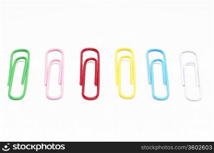 Row of multi colored paper clips