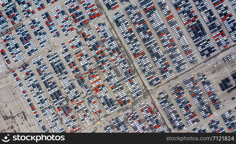 Row of new cars for sale in port at cars export terminal.