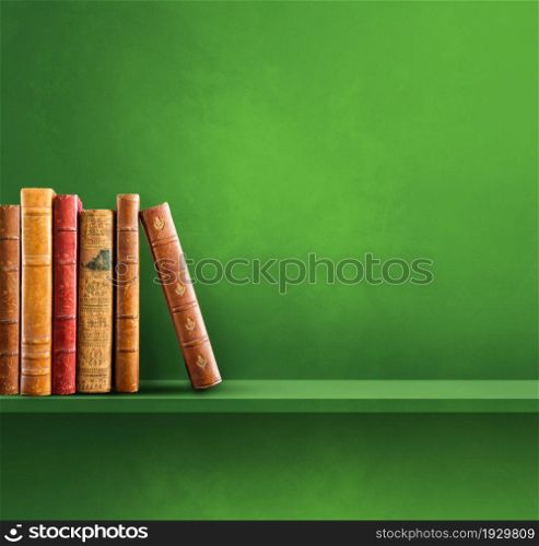 Row of old books on green shelf. Square scene background. Row of old books on green shelf. Square background