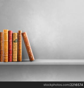 Row of old books on grey shelf. Square scene background. Row of old books on grey shelf. Square background