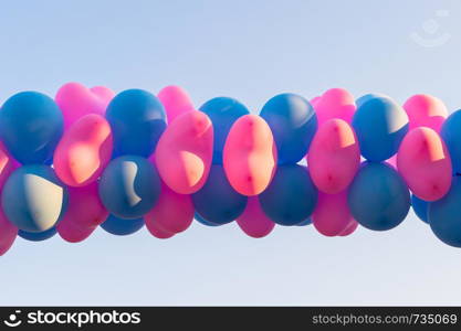 row of pink and blue balloon background