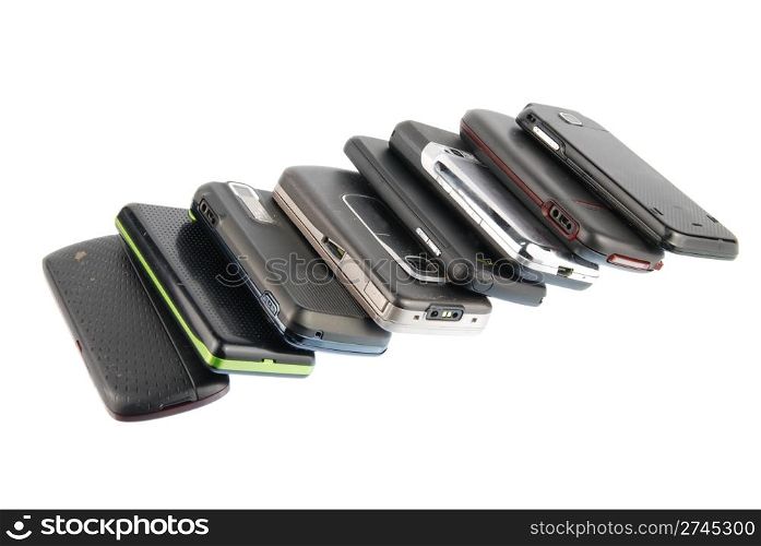 row of several mobile phones isolated on white background