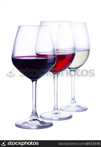 Row of three wine glasses with red, white and rose wine isolated on white background. Set of glasses with wine