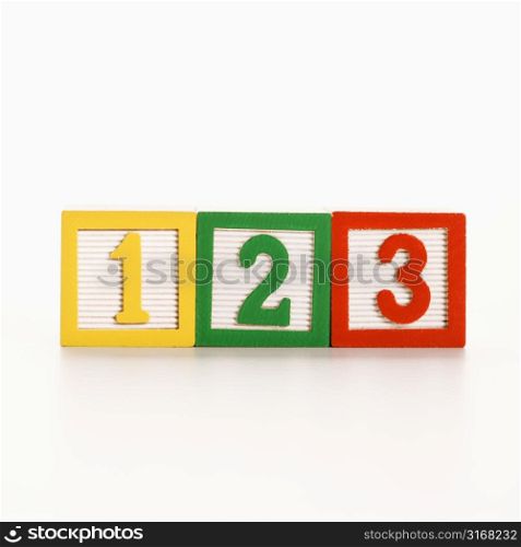 Row of toy building blocks with numbers.