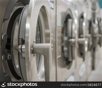 Row of washing machines at a public laundrette