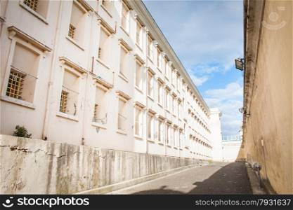 Row of windows with bars in old prison.