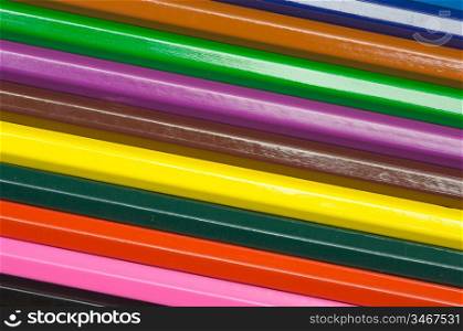 row of wooden pencils of many colors