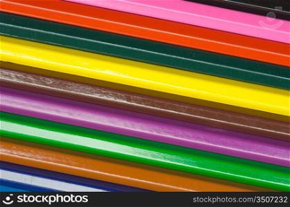 row of wooden pencils of many colors