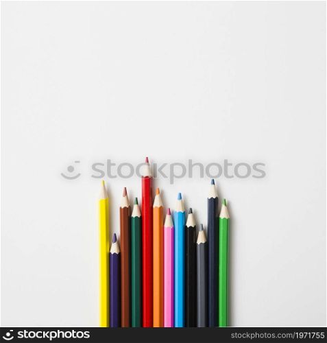 row sharp colored pencils against white background. High resolution photo. row sharp colored pencils against white background. High quality photo