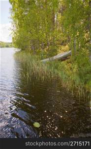 Rowboat stranded ashore at a lake in Finland