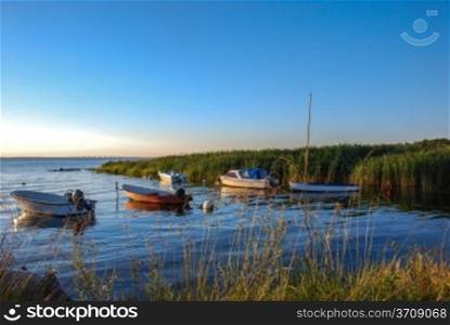 Rowing boats in a calm bay of the Baltic sea at the swedish island Oland