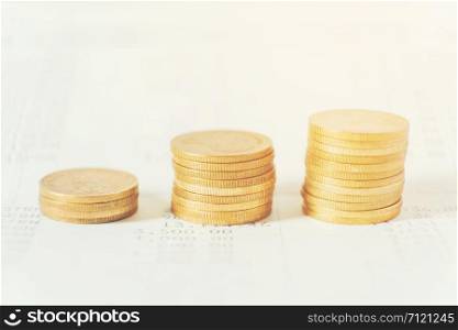 Rows of coins for finance and banking on digital stock market financial concept