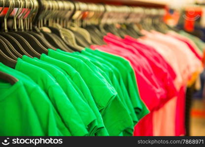 rows of cotton T-shirts in a large store