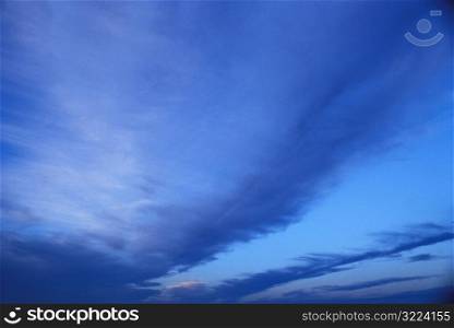 Rows Of Dark Clouds In A Light Blue Sky