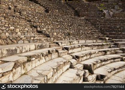 Rows of marble stone seats rise up in the ancient Greek theater at Ephesus in Turkey. There are two theaters in Ephesus and this is the small theatre.