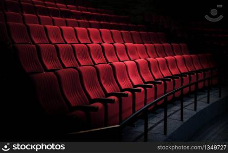 Rows of red seats in a theater