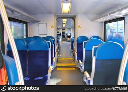 Rows of seats in a passenger train car.