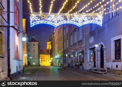 Royal Castle and beautiful street in Old Town at night , Warsaw, Poland.. Beautiful street in Old Town of Warsaw, Poland