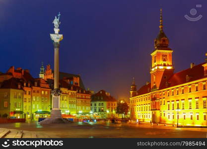 Royal Castle and Sigismund Column at Castle Square illuminated in Warsaw Old town at night, Poland.