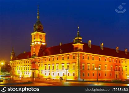 Royal Castle at Castle Square illuminated in Warsaw Old town at rainy night, Poland.