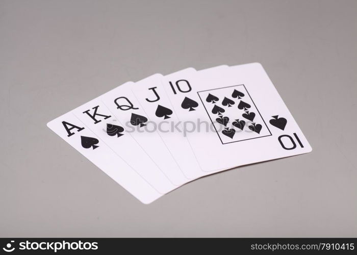 Royal Flush (playing cards) on gray background