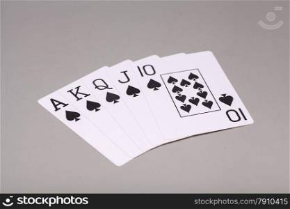 Royal Flush (playing cards) on gray background