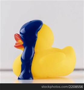 rubber duck with blue paint dripping