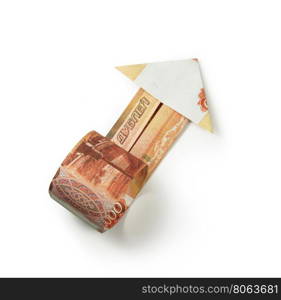 rubles arrow origami. Arrow origami made of rubles bills on a white background