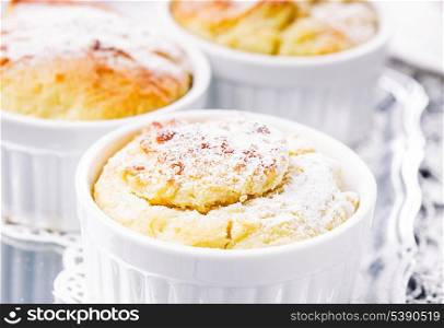 Ruddy cheese cupcakes with icing sugar closeup
