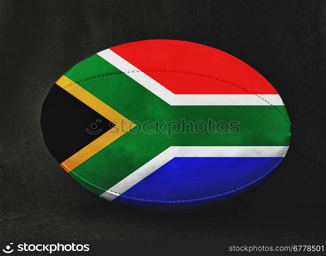 Rugby ball with South Africa flag colors, over black background